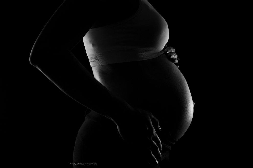 Picture of a pregnant woman shown in profile.
